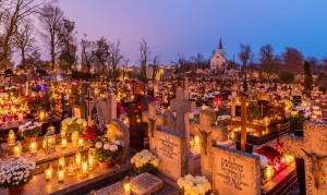 All Saints'Day at a cemetery in Gniezno, Poland – flowers and candles placed to honor deceased relatives